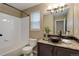 Cozy bathroom with a granite-topped vanity, and shower-tub combination at 354 Willowick Cir, Highlands Ranch, CO 80129
