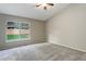 Bedroom with vaulted ceiling and plush carpet at 354 Willowick Cir, Highlands Ranch, CO 80129