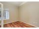 Cozy bedroom showcases hardwood floors, ample natural light, and neutral wall colors at 354 Willowick Cir, Highlands Ranch, CO 80129