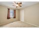 Bedroom features a ceiling fan, window with blinds and curtains, and a closet at 354 Willowick Cir, Highlands Ranch, CO 80129