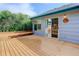 Wooden deck with bench seating, offering a relaxing spot for outdoor enjoyment and entertaining at 354 Willowick Cir, Highlands Ranch, CO 80129