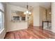 Dining room with hardwood floors, chandelier, and a view into the kitchen at 354 Willowick Cir, Highlands Ranch, CO 80129