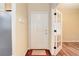 The foyer features hardwood floors, coat hooks, and a door with glass panels at 354 Willowick Cir, Highlands Ranch, CO 80129