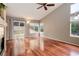 Spacious living room with hardwood floors and a sliding glass door to the patio at 354 Willowick Cir, Highlands Ranch, CO 80129