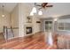 The living room features hardwood floors, a ceiling fan, and a cozy fireplace at 354 Willowick Cir, Highlands Ranch, CO 80129