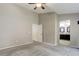 Spacious main bedroom featuring a ceiling fan, and access to the en-suite bathroom at 354 Willowick Cir, Highlands Ranch, CO 80129