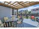 Charming back deck with ample seating, a retractable cover and a beautiful view, perfect for relaxing at 537 N 48Th Ave, Brighton, CO 80601