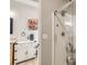 Bathroom featuring a glass shower, tiled floors, modern lighting, and vanity at 537 N 48Th Ave, Brighton, CO 80601