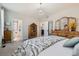 Spacious bedroom with closet, ensuite bathroom, decorative chandelier and bright natural light at 537 N 48Th Ave, Brighton, CO 80601