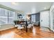 Dining Room features hardwood floors, elegant light fixture, and neutral color palette at 537 N 48Th Ave, Brighton, CO 80601
