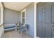 Charming covered porch with seating and stylish accents at 537 N 48Th Ave, Brighton, CO 80601
