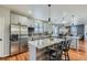 Modern kitchen featuring stainless steel appliances, gray cabinets, and a center island with bar seating at 537 N 48Th Ave, Brighton, CO 80601