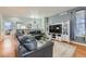 Living room boasting comfortable leather sofas, hardwood flooring, and modern decor at 537 N 48Th Ave, Brighton, CO 80601