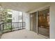 Empty balcony with sliding glass doors and black metal railing at 2325 S Linden Ct # 206, Denver, CO 80222
