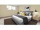 Cozy bedroom with a comfortable bed, stylish lamps, and a serene atmosphere at 2325 S Linden Ct # 206, Denver, CO 80222