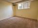 Neutral bedroom with window offering lots of light, and neutral carpet flooring at 2325 S Linden Ct # 206, Denver, CO 80222