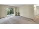 Spacious living room with sliding glass door and access to outdoor balcony at 2325 S Linden Ct # 206, Denver, CO 80222
