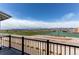Balcony overlooking sports fields and mountain views under a bright blue sky at 767 Robert St, Longmont, CO 80503