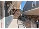 Charming front porch with a metal railing and partial view of the neighboring properties at 767 Robert St, Longmont, CO 80503