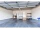 Spacious garage with concrete flooring and ample storage space at 767 Robert St, Longmont, CO 80503