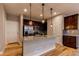 Well-equipped kitchen featuring stainless steel appliances, granite counters, and wooden cabinetry at 767 Robert St, Longmont, CO 80503
