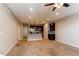 Open-concept living area flows into a modern kitchen with stainless steel appliances at 767 Robert St, Longmont, CO 80503