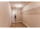Functional walk-in closet equipped with metal shelving and neutral carpet at 767 Robert St, Longmont, CO 80503