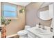 Well-lit bathroom with a modern vanity, round mirror, and clean, neutral tones for a relaxing atmosphere at 15962 E Lehigh Cir, Aurora, CO 80013