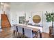 Dining room with hardwood floors, neutral walls, seating for six, and views of a staircase at 15962 E Lehigh Cir, Aurora, CO 80013