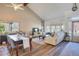 Bright living room with vaulted ceilings, hardwood floors, and a bay window offering lots of natural light at 15962 E Lehigh Cir, Aurora, CO 80013