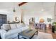 Cozy living room with a large sectional, hardwood floors, dining area, and lots of natural light at 15962 E Lehigh Cir, Aurora, CO 80013
