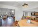 Inviting living room with hardwood floors, bright lighting and an open floor plan to the dining and kitchen areas at 15962 E Lehigh Cir, Aurora, CO 80013