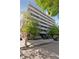 Beautiful multi-story building featuring spacious balconies and lush green trees surrounding the property at 1441 N Humboldt St # 505, Denver, CO 80218