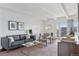 Cozy living room features a modern aesthetic, stylish decor, and plenty of natural light at 1441 N Humboldt St # 505, Denver, CO 80218