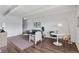 Open living room with wood floors, stylish decor, and a designated dining area at 1441 N Humboldt St # 505, Denver, CO 80218
