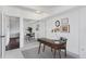 Bright office space with desk and chair near mirrored closets, access to the hallway and carpet at 1441 N Humboldt St # 505, Denver, CO 80218