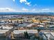 Expansive aerial shot of a residential area featuring apartment homes, and a scenic landscape with mountain views at 650 S Clinton St # 6D, Denver, CO 80247