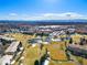 Aerial view of the community featuring a golf course, several ponds, and well-maintained landscaping at 650 S Clinton St # 6D, Denver, CO 80247