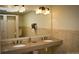 The beautiful granite countertops complement the double vanity sink in this restroom at 650 S Clinton St # 6D, Denver, CO 80247