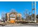 Exterior shot of Windsor Gardens, showcasing well-maintained landscaping and community signage at 650 S Clinton St # 6D, Denver, CO 80247