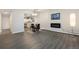 Well-lit living area with an open layout offering views of the kitchen and ample space for entertaining at 650 S Clinton St # 6D, Denver, CO 80247