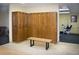 Wooden lockers and a seating bench in this convenient locker room at 650 S Clinton St # 6D, Denver, CO 80247