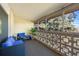 Enclosed patio with cozy blue furniture and decorative privacy screen, perfect for relaxing outdoors at 650 S Clinton St # 6D, Denver, CO 80247