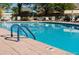 Inviting community pool with a blue ladder and chairs, perfect for relaxation and recreation at 650 S Clinton St # 6D, Denver, CO 80247