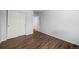 Well-lit bedroom with wood floors and closet at 21950 E Crestline Ln, Aurora, CO 80015