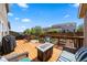 Beautiful wooden deck offering a relaxing outdoor living space with seating and a grill at 21950 E Crestline Ln, Aurora, CO 80015
