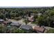 The aerial view of a tree-lined neighborhood reveals a peaceful residential area, combining natural beauty and community living at 6931 W 75Th Pl, Arvada, CO 80003