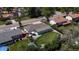 Aerial view of a well-maintained backyard with a stone patio and lush green lawn, perfect for outdoor entertaining and relaxation at 6931 W 75Th Pl, Arvada, CO 80003