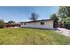 The home's backyard has grass and a patio at 6931 W 75Th Pl, Arvada, CO 80003