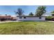 The backyard features a well-maintained lawn at 6931 W 75Th Pl, Arvada, CO 80003